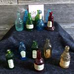 13 vintage colored bottles