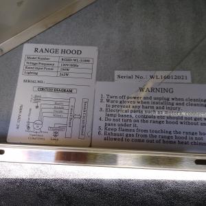 Photo of stainless steel oven range hood. 