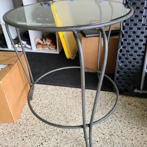 Photo of Black Rod iron end table with glass top.