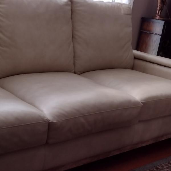 Photo of Leather Sofa and matching ottoman $700