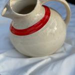 Vintage Orange striped pitcher with unique shape