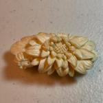 Carved floral brooch