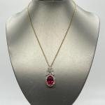 LOT 76: Jacqueline Kennedy Reproduction Simulated Ruby Drop Pendant with 18" Cha