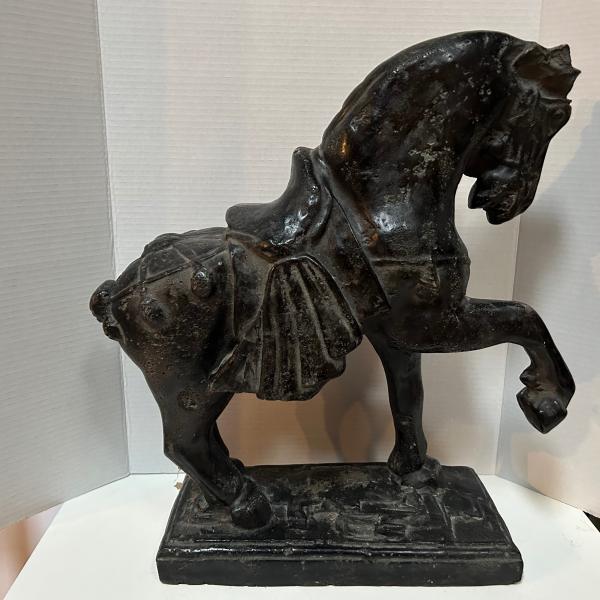 Photo of Large charcoal colored horse statue 