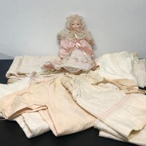 Photo of Lot 89: Vintage Larger Baby Doll Clothing w/Small Ceramic Doll