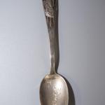 Early 1900's STERLING SOUVENIR SPOON WITH NATIVE AMERICAN FIGURE HOLDING SHIELD.
