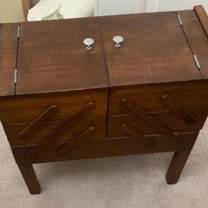 Photo of Vintage wood concertinia sewing chest on legs