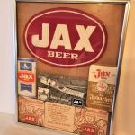 Lot #31  Framed JAX Beer Memorabilia - Notepads, Photo Postcard, Coasters, Unifo