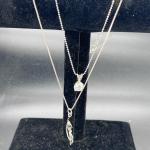 Two sterling pendants and chains