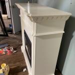 Working Heater with white fireplace mantle