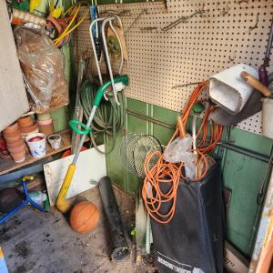 Photo of Contents of Outdoor Garden Shed Planter Pots, Garden Tools
