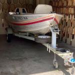 1990 Western Fishing Boat With Johnson 9.9 HP Motor And 1987 Tomco Coated Traile