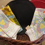 Large basket with Easter towels and placemats