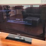 Lot #183  SAMSUMG Flat Screen Television on Stand w/remote