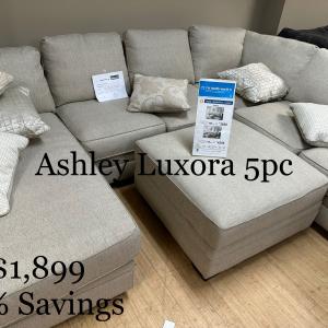 Photo of Ashley Luxora New Sectional with storage ottoman
