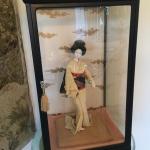 Geisha doll in glass case