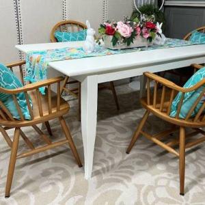 Photo of White Table and four Captains Chairs
