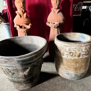 Photo of Clay Pottery and Bird Bath statues