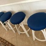 Four  swivel bar counter stools