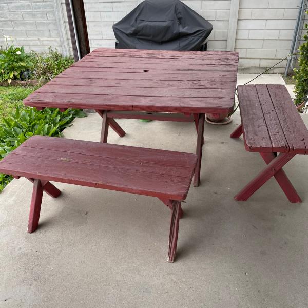 Photo of Wooden picnic benches and table