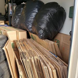 Photo of Packing Boxes, Papers and Blankets