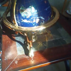 Photo of World Globe on Gold Stand