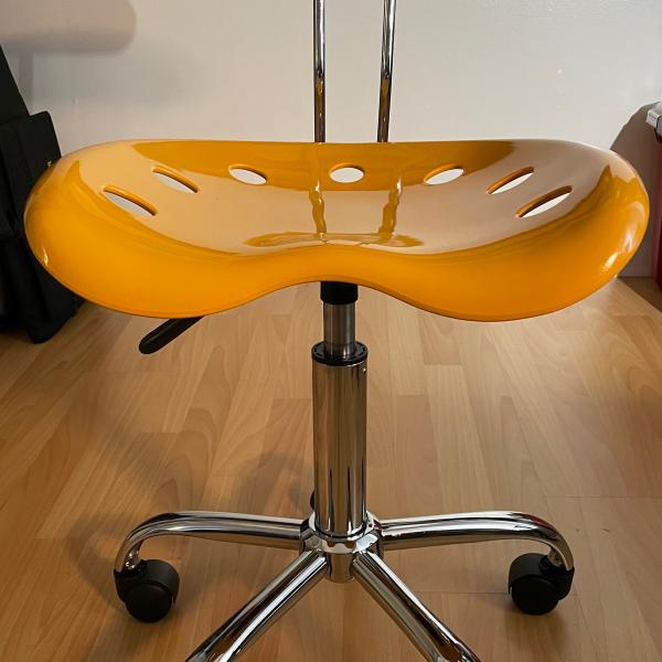 Photo of Small Yellow Molded Plastic Chair on Chrome Metal Base with Castors