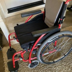 Photo of DELUXE ULTRALIGHT WHEELCHAIR w/foot rests,  pad