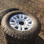 285 A/T TOYO 18’ x 9” 8 LUG. TIRES AND ALUMINUM WHEELS  4,900 MILES
