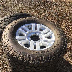 Photo of 285 A/T TOYO 18’ x 9” 8 LUG. TIRES AND ALUMINUM WHEELS  4,900 MILES