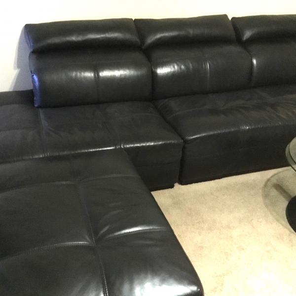 Photo of Real leather black sofa