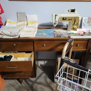 Photo of Used Singer sewing machine in cabinet
