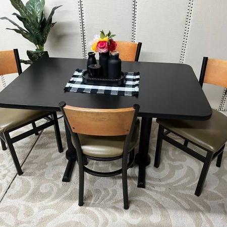 Photo of Black Table and four Chairs