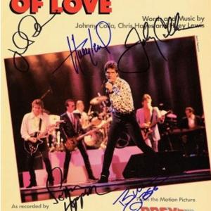 Photo of Huey Lewis and the News signed sheet music