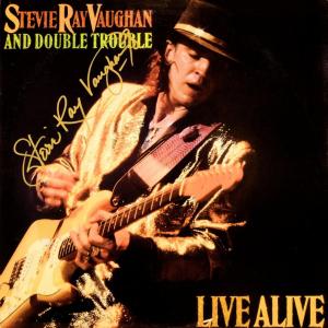 Photo of Stevie Ray Vaughan and Double Trouble signed Live Alive album