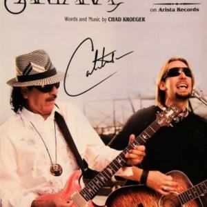Photo of Carlos Santana signed sheet music 