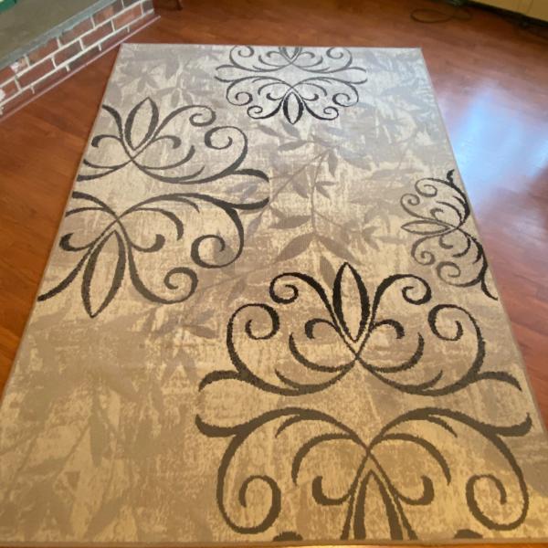 Photo of Beige floral area rug 60"x90" Nice condition.