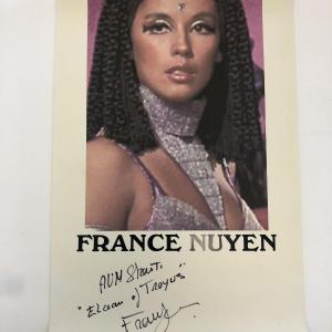 Photo of France Nuyen signed poster