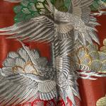 Beautiful red Japanese Uchikake ceremonial kimono featuring embroidered cranes.