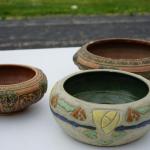 GROUPING OF THREE ROSEVILLE LOW BOWL PLANTERS.