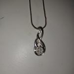 Kays jewelers necklace with diamond pendent and 1 with diamonds and a pearl