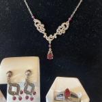 Silver and dark red stones set