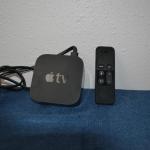 LOT 194. APPLE TV AND REMOTE