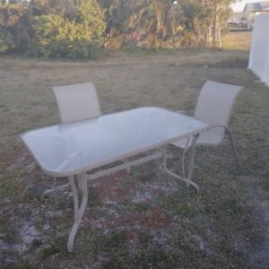 Photo of Patio table with four chairs