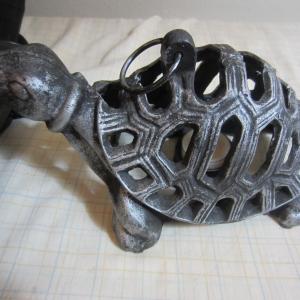 Photo of 9 AND 1/2 INCH LONG STEEL TURTLE WITH CANDLE HOLDER