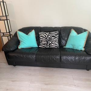 Photo of Black Natuzzi Leather Couch