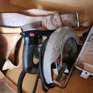 Photo of Skill saw and tool belt.