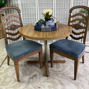 Photo of Table and two blue Chairs