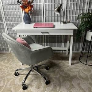 Photo of White Desk and Gray Velvet Chair