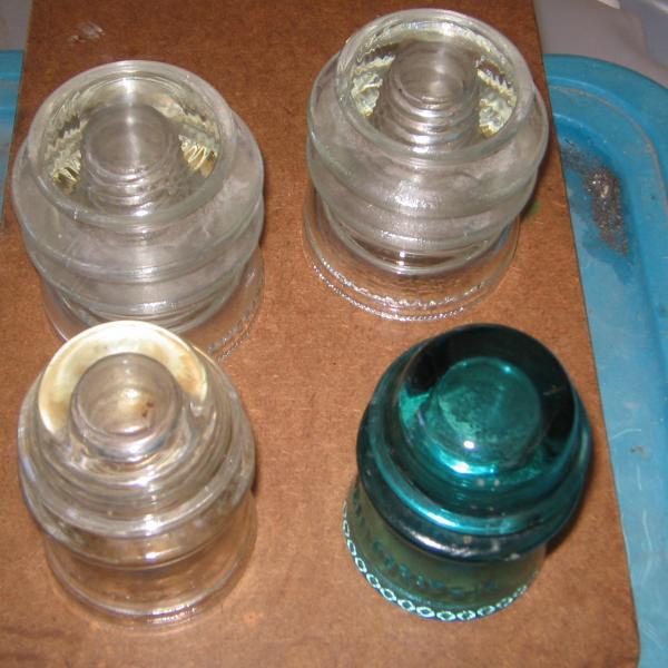 Photo of 4 Vintage glass insulators
